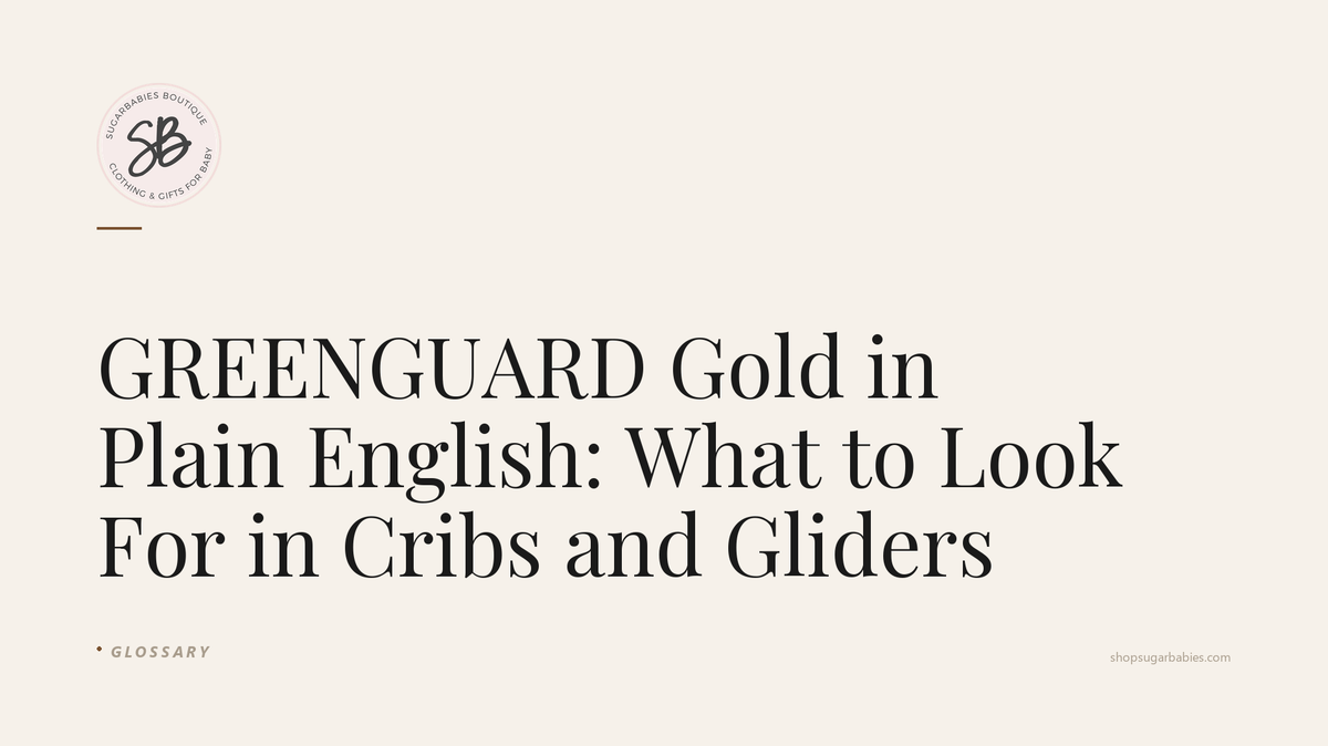 Editorial blog hero for SugarBabies: GREENGUARD Gold in Plain English: What to Look For in Cribs and Gliders. Templated brand graphic (warm cream background, SugarBabies logo, post title in Playfair Display, category tag). No AI-generated photo content.